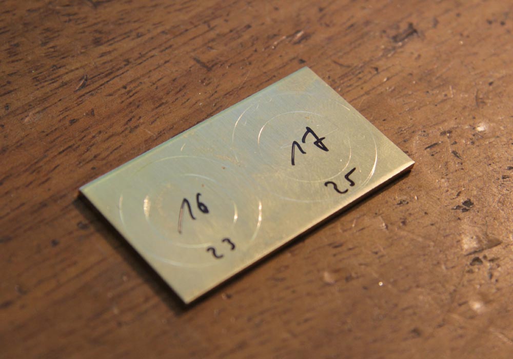 Gold sheet with markings for punching the wedding ring blanks in the wedding ring course