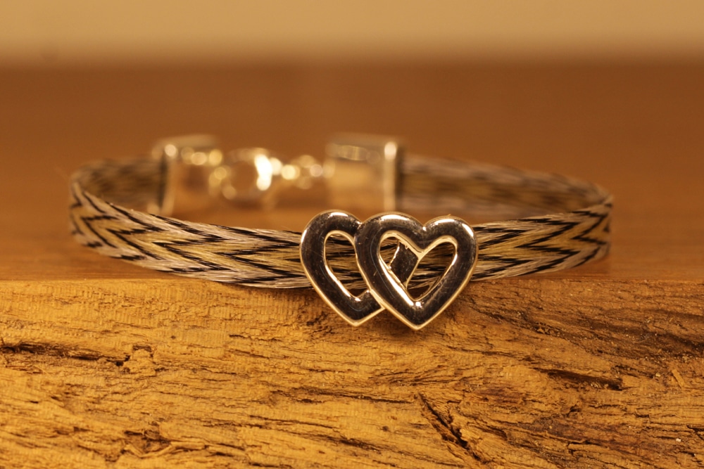 horse hair jewelry - bracelet with double heart element made of silver and silver clasp