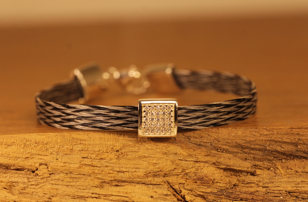 bracelet made of woven horsehair with silver spacer and clasp with cubic zirconia