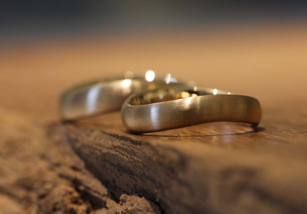 Image 063b: curved palladium wedding rings, wave shape.