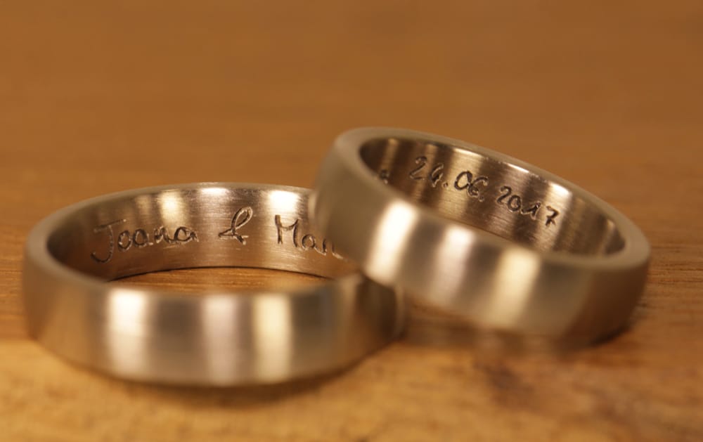 laser engraving very personal in plain gray gold wedding rings