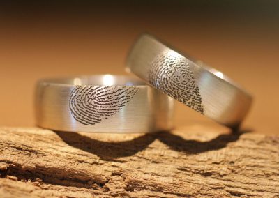 special silver wedding rings with laser engraving heart shape from fingerprint one half of a heart on each side