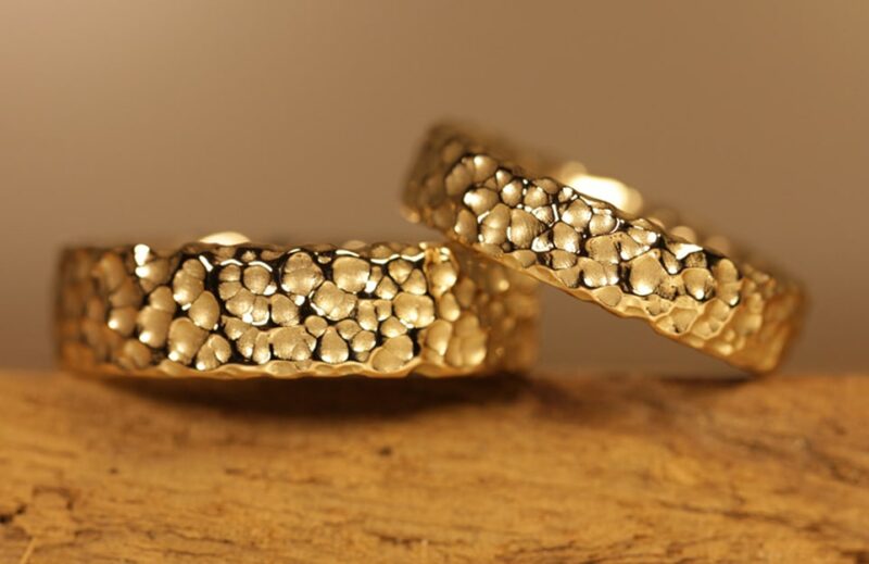 Wonderful wedding rings made of 585 yellow gold surface bubbles