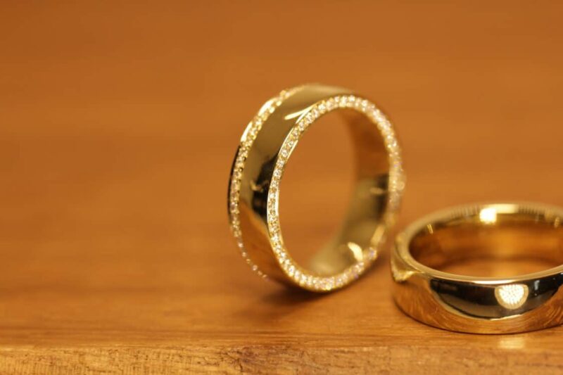 Polished wedding rings in 750 yellow gold Ladies' ring decorated with white diamonds all around