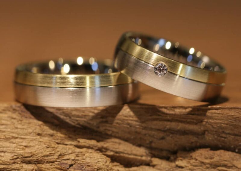 Wedding rings, disc rings, two-tone, made of 585 gray gold and yellow gold. Ladies' ring with diamonds