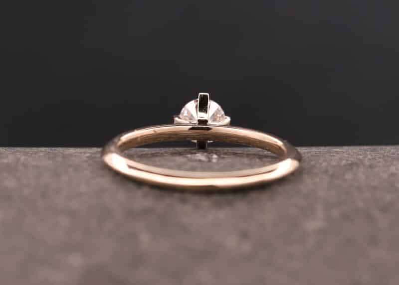 rose gold solitaire ring with diamond in a four prong setting