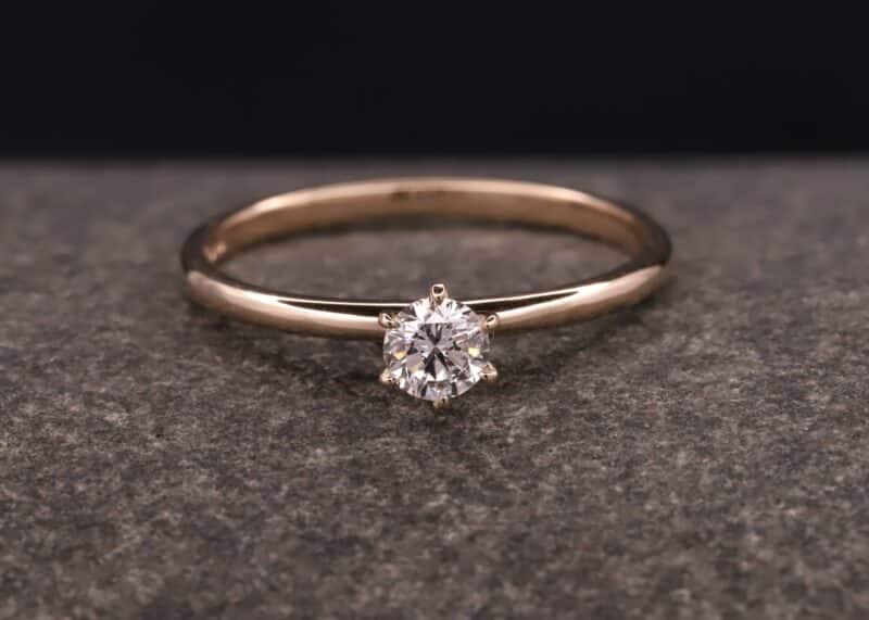 rose gold ring with a brilliant in a six claw setting
