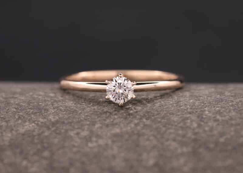 rose gold ring with a brilliant in a six claw setting