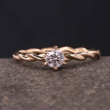 gedrehter ring - kordiert - aus 585 gold mit diamant in krappen-fassung stolberg