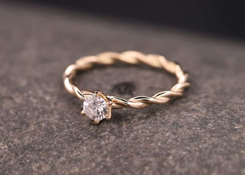 twisted ring - corded - made of 585 gold with diamond in claw setting stolberg